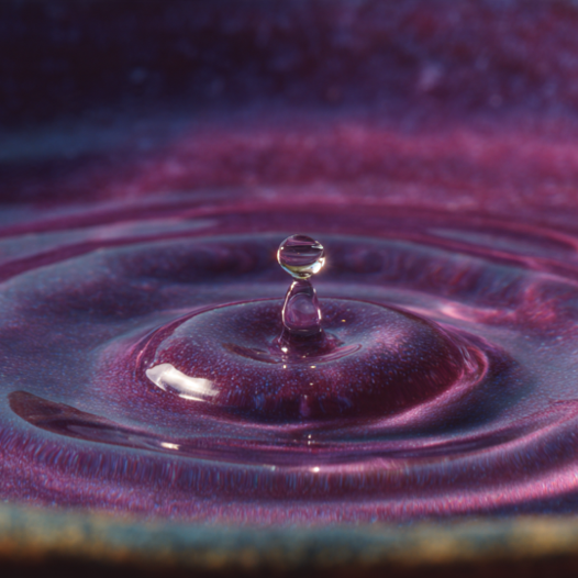 Ripples spreading across water, sound vibration made visible