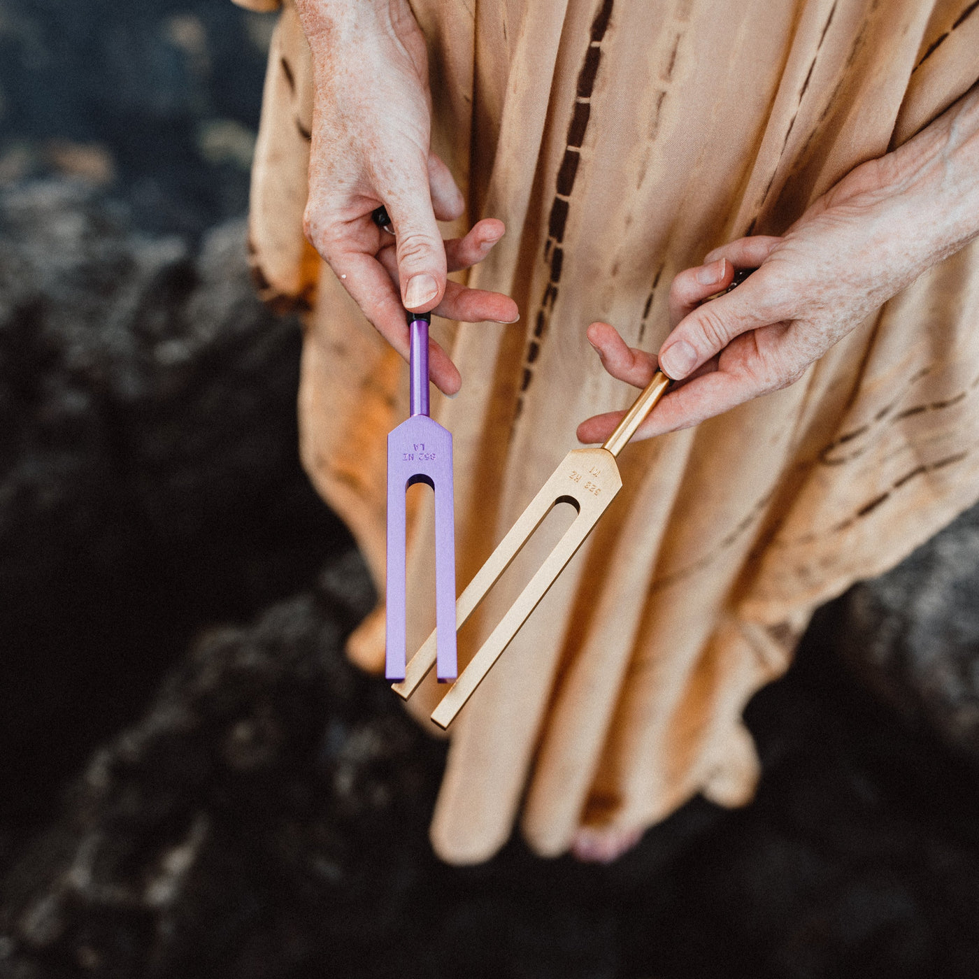 A SomaEnergetics practitioner working with tuning forks