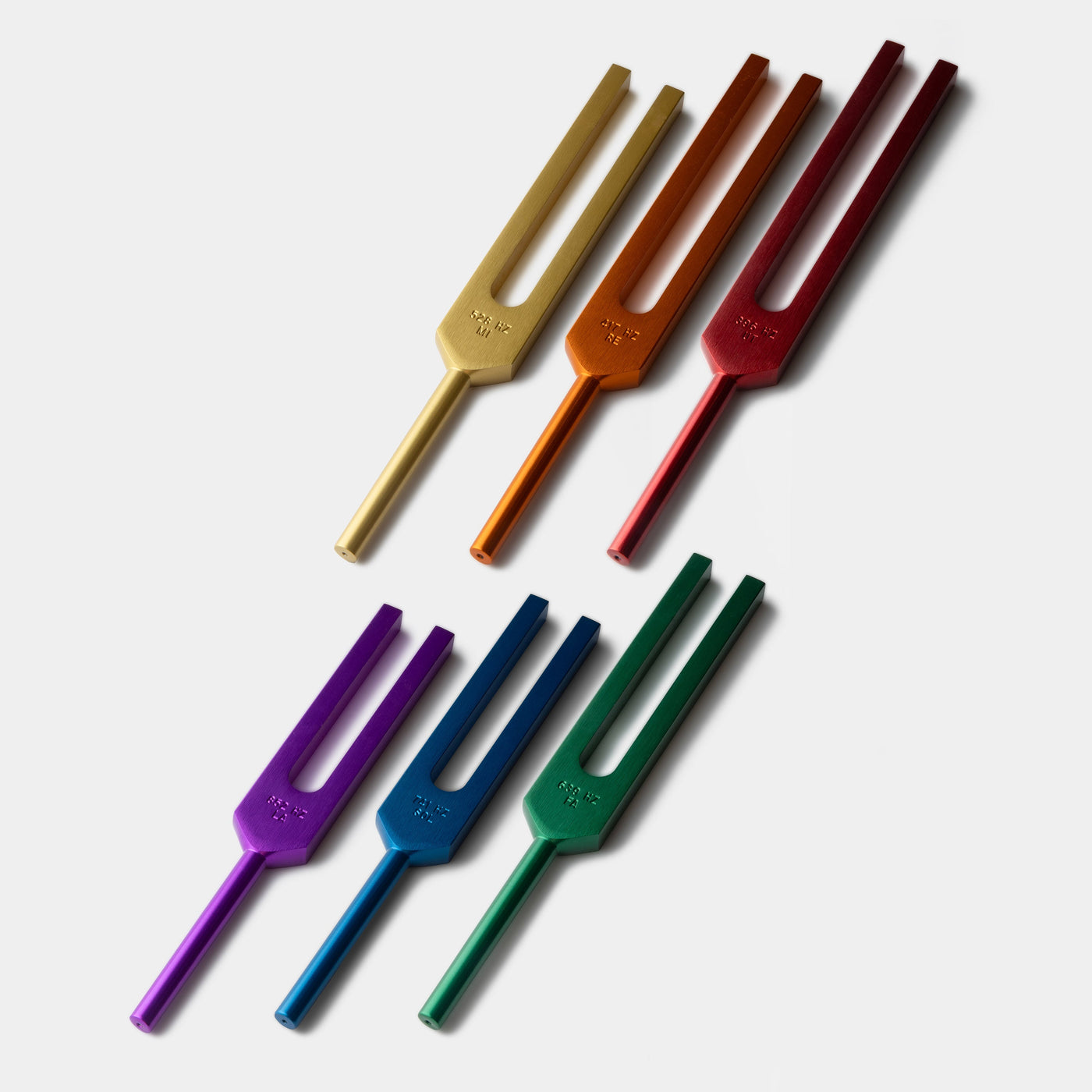 The six Solfeggio Energy Tuners in red, orange, gold, green, blue and purple