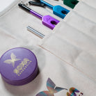 Closeup of Cotton Canvas Tuning Fork Apron Roll Bag with attached tuning fork sounding puck. 